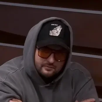 Drew 3 Drew seated playing low stakes cash game poker on the Champions Poker Live stream.