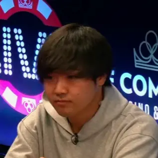 Tomoki Tomoki seated playing high stakes cash game poker on the Bally Live Poker livestream.