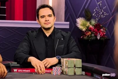 Alan Keating seated playing high stakes cash game poker on PokerGO